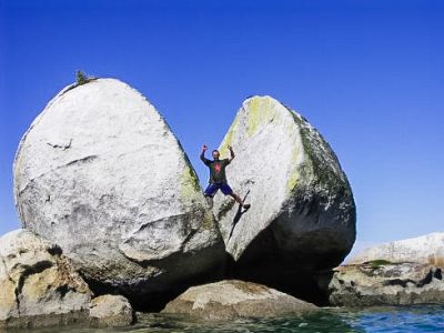 Man between two large rocks.