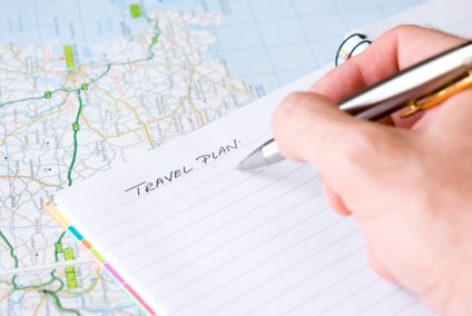 Hand writing travel plan.